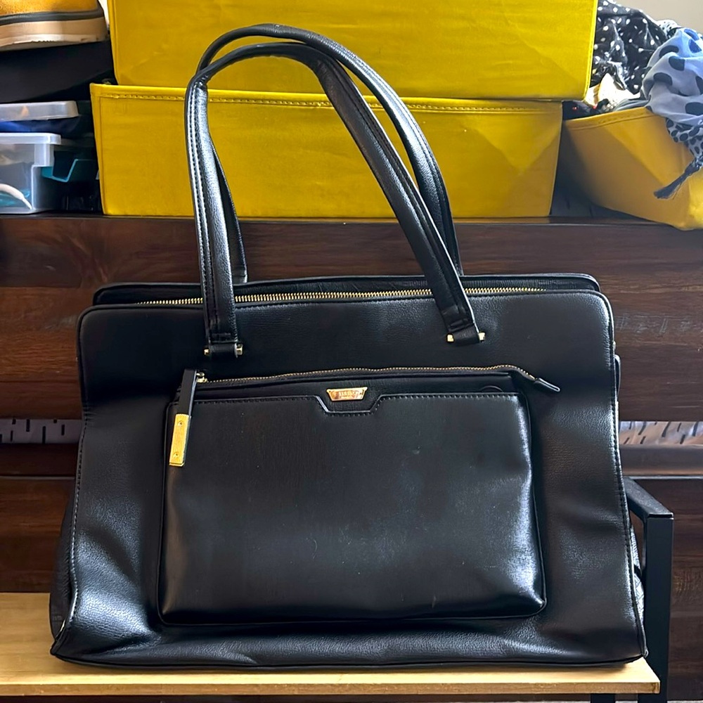Tutilo laptop tote bag. Lot of inside pockets. Never used.